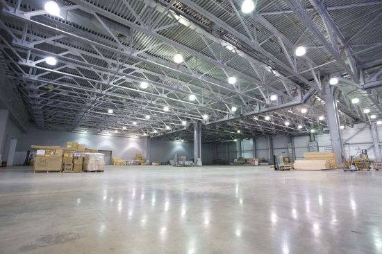 A large, empty warehouse with a clean floor
