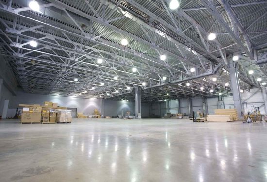 A large, empty warehouse with a clean floor