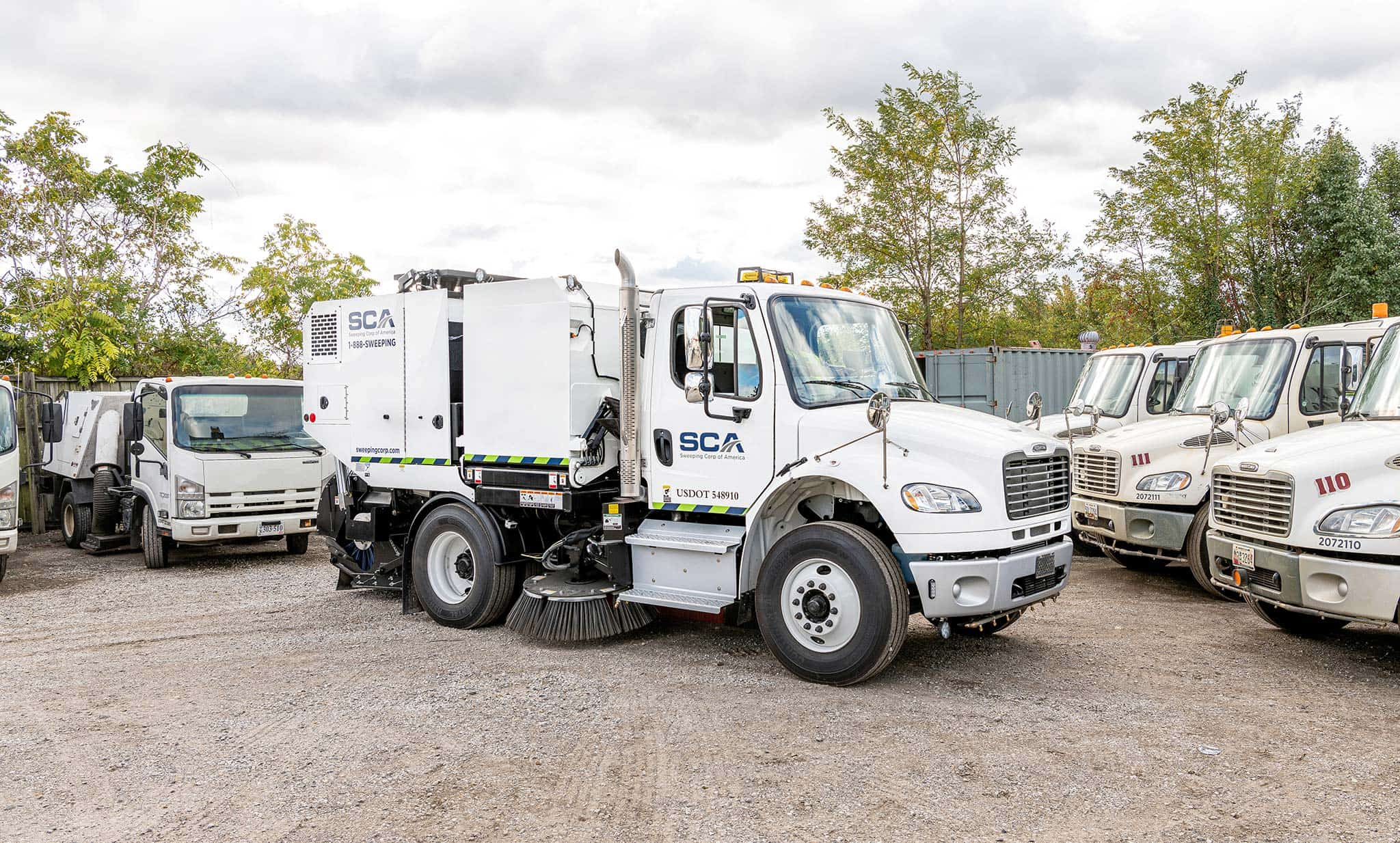 A group of sweeping trucks