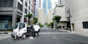 street sweeper cleaning up a city street