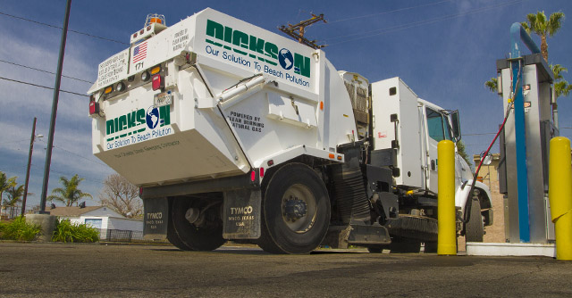 Street Sweeper truck filling up at a CNG fueling station.